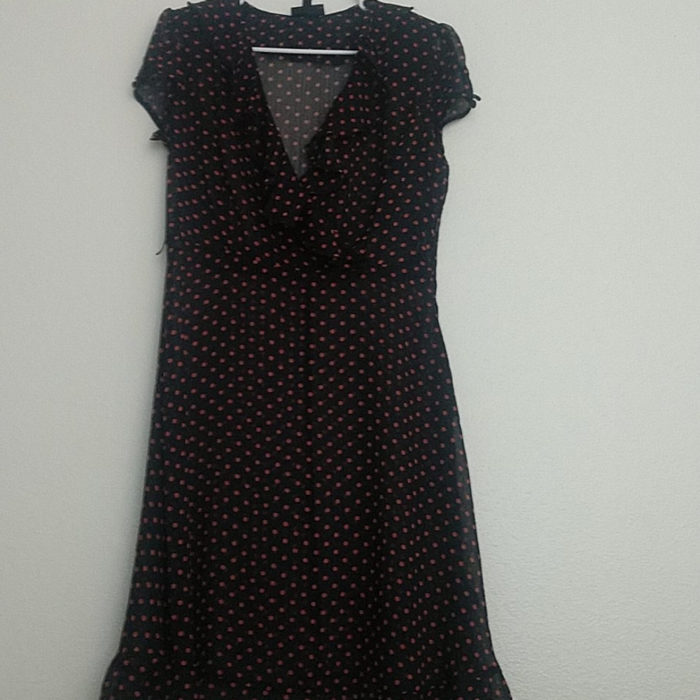 Shear, navy blue with salmon colored polka dots.